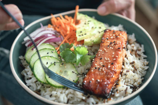 istock Spicy Salmon Bowl with Rice, Carrots, Cucumber and Avocado 1719031981