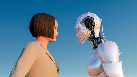 Side view of a business woman and AI female robot face to face against blue background. 3D rendering of human being versus artificial intelligence.