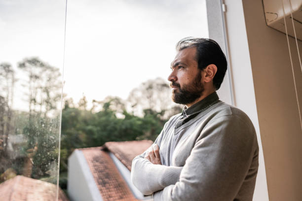 istock Mature man contemplating at home 1719058388