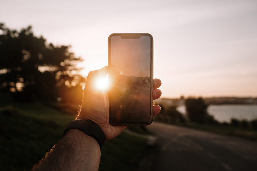 Taking a photo at sunset with a smart phone