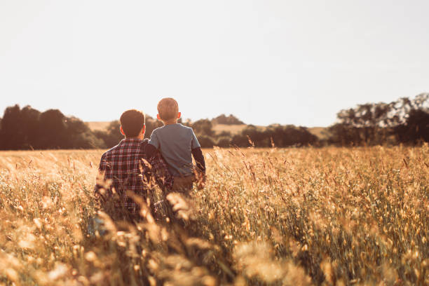 istock Father and son in the field. 1719067120