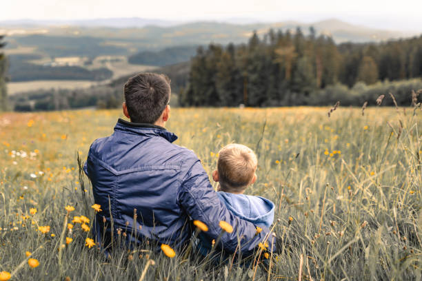 istock Father and son enjoying beautiful nature surroundings. 1719079180