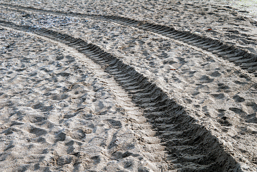Tire tracks on sand. Background and texture.