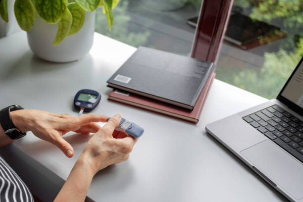 istock Mature woman checking blood sugar 1719106510