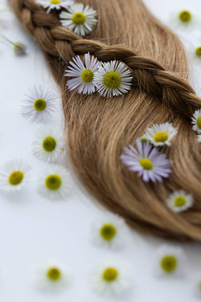istock Hair with flowers. Closeup, selective focus. 1719114141
