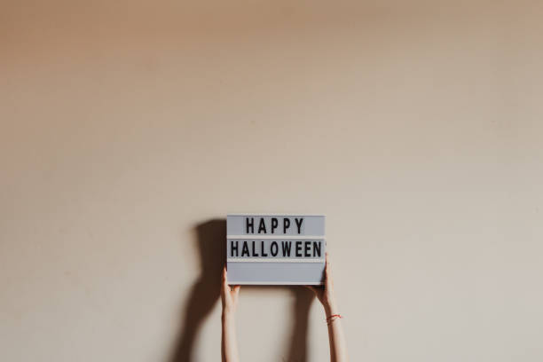 istock hands holding  happy halloween placard 1719125934
