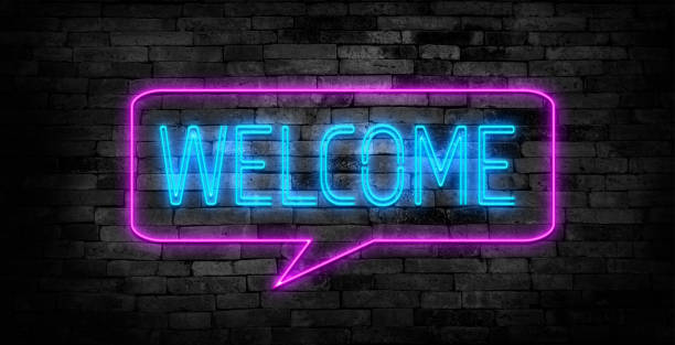 istock Welcome neon sign on brick wall background. 1719154941