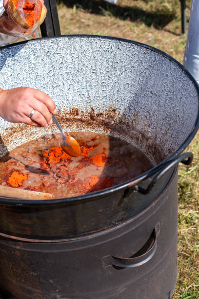 stew cooking in a cauldron, cooking goulash in a cauldron.