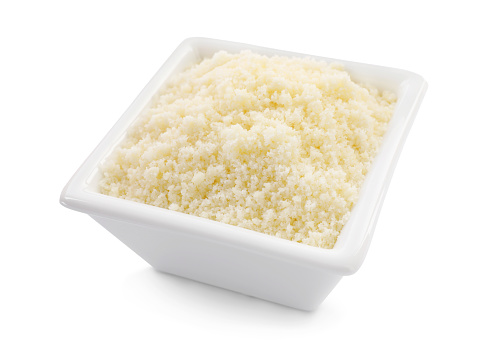 Square bowl with grated parmesan cheese isolated on white