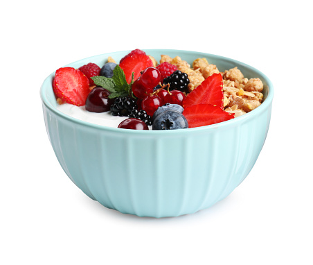 Tasty granola with berries on white background. Healthy meal