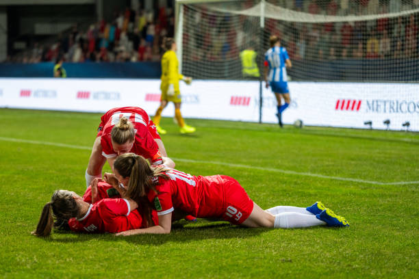 istock Happy soccer players lying on field, scoring a goal 1719200564