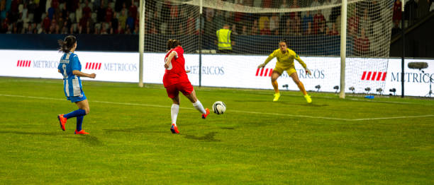 istock Female soccer players scoring a goal 1719200566