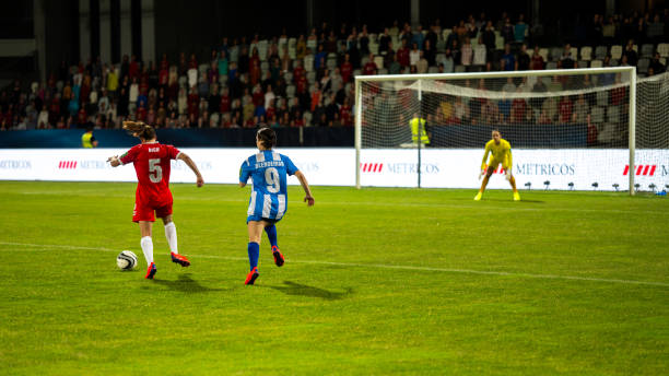 istock Female soccer players scoring a goal 1719200570
