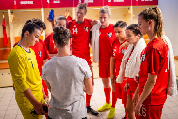 istock Football trainer explaining game strategy to players 1719200639