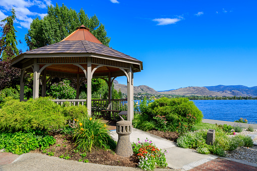 Wooden gazebo in a garden park on the waterfront of Osoyoos Lake located in the Okanagan Valley, Osoyoos, British Columbia, Canada.