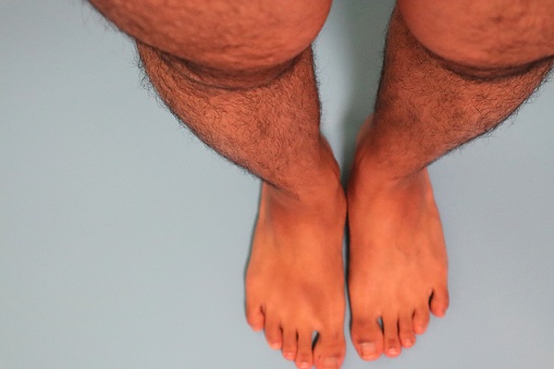 Close-up photo of hairy Japanese male legs