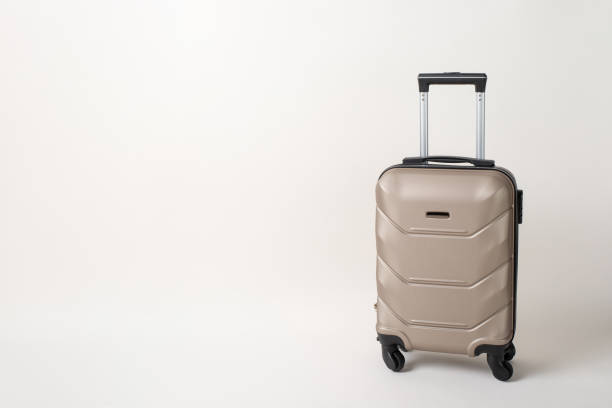 istock On-the-Go Essentials: Trendy suitcase showcased in a side view image, set against a white background, with space for text or advertising 1719212472
