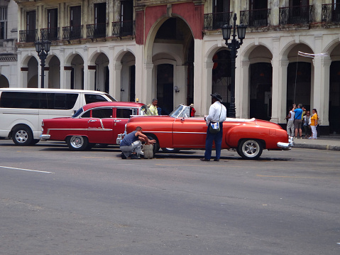 Vibrant and lively streets of Havana, Cuba, adorned with colorful buildings, classic cars, and a rich blend of Cuban culture.