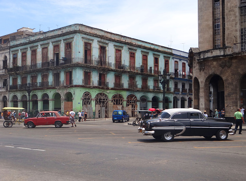 Vibrant and lively streets of Havana, Cuba, adorned with colorful buildings, classic cars, and a rich blend of Cuban culture.