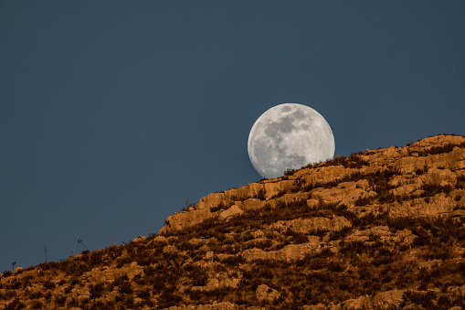 Super high quality (67 Megapixels!) full moon with extreme level of detail and clearly visible craters on the surface and peaks on the grazing angle.