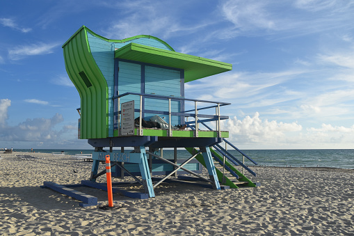 A vibrant lifeguard tower stands tall on the iconic Miami Beach in Miami, Florida, USA, adding a colorful touch to the sun-soaked coastal scene.