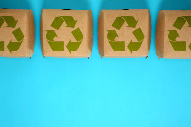 istock Paper boxes with recycling symbols on turquoise background, flat lay. Space for text 1719262330