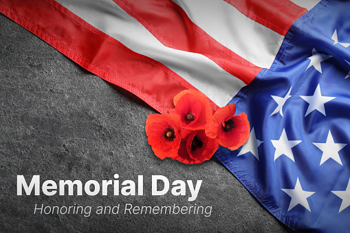 Memorial Day, Honoring and Remembering. American flag and red poppy flowers on grey background, closeup