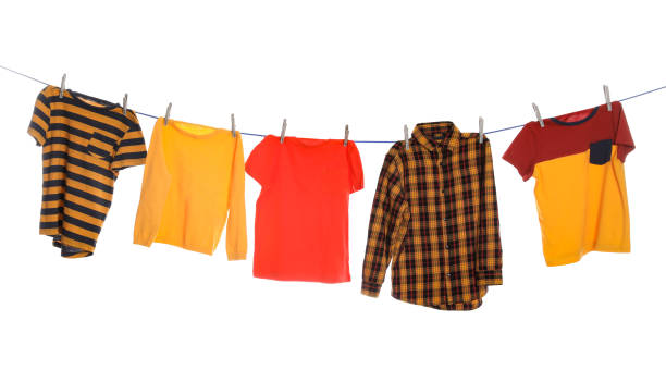 istock Different bright clothes drying on washing line against white background 1719282920