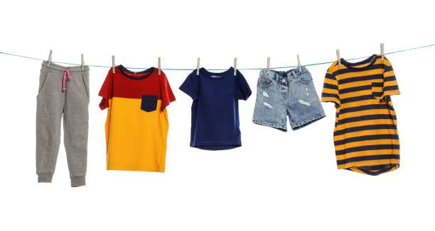 Different clothes drying on washing line against white background