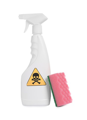 Bottle of toxic household chemical with warning sign and scouring sponge on white background