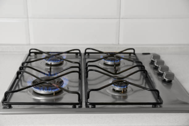 istock Gas cooktop with burning blue flames in kitchen 1719287169