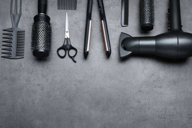 istock Flat lay composition of professional hairdresser tools on dark grey table, space for text 1719287189