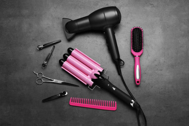 istock Flat lay composition of different professional hairdresser tools on dark grey table 1719287192