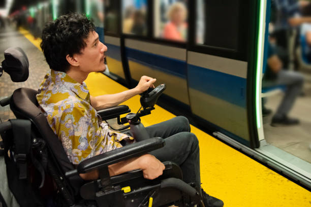 istock Young asian man using a wheelchair in a subway station. 1719309794