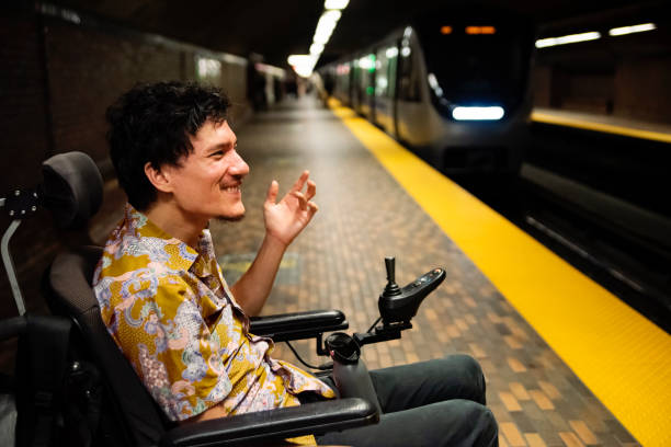 istock Young asian man using a wheelchair in a subway station. 1719309814