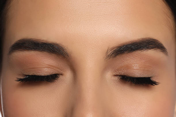 istock Beautiful young woman with long eyelashes, closeup 1719331849