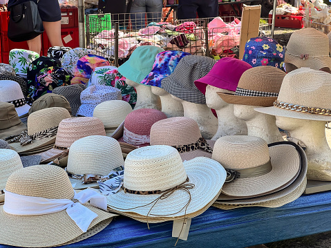 The famous bazaar in the town of Zarki in Poland, hats and caps for sale.