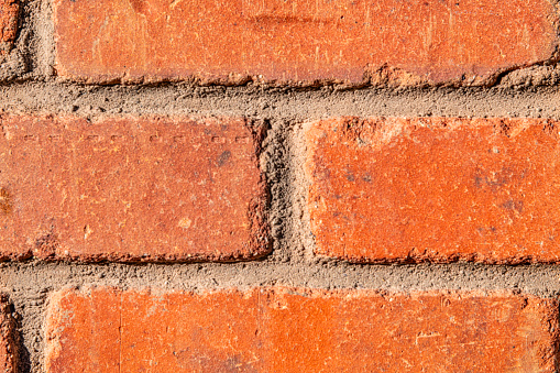 An old brick wall on the exterior of an historic building located in downtown Telluride, Colorado.