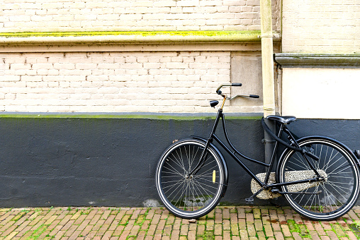 Old Bicycle Against a Painted Brick Wall