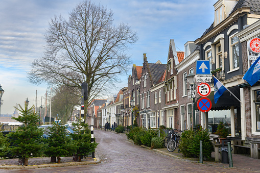 In Muiden, Netherlands the clean brick streets are empty early in the morning and are lined with Dutch style buildings.