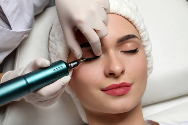 istock Young woman undergoing procedure of permanent eye makeup, closeup 1719442897