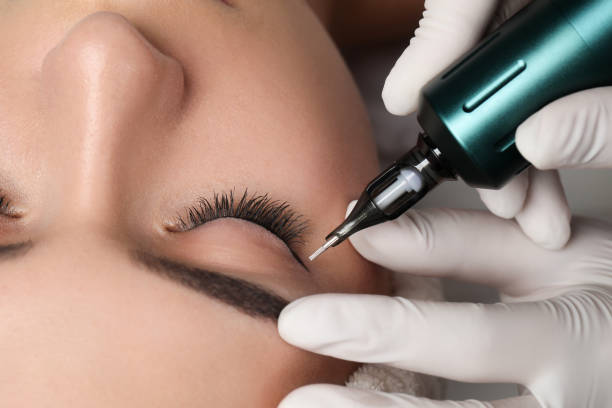 istock Young woman undergoing procedure of permanent eye makeup, closeup 1719450816