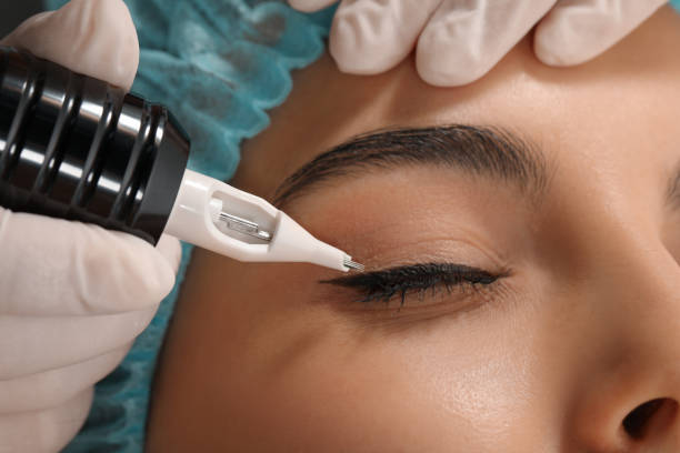 istock Young woman undergoing procedure of permanent eyeliner makeup, closeup 1719451388