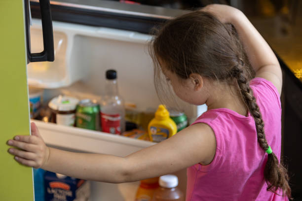 istock child chooses food from the refrigerator 1719467896