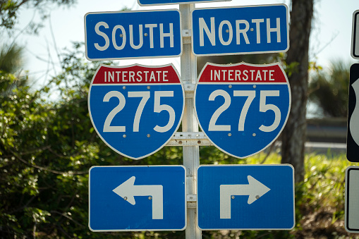 Blue direstional road sign indicating direction to I-275 freeway interstate highway serving the Tampa Bay area in Florida.