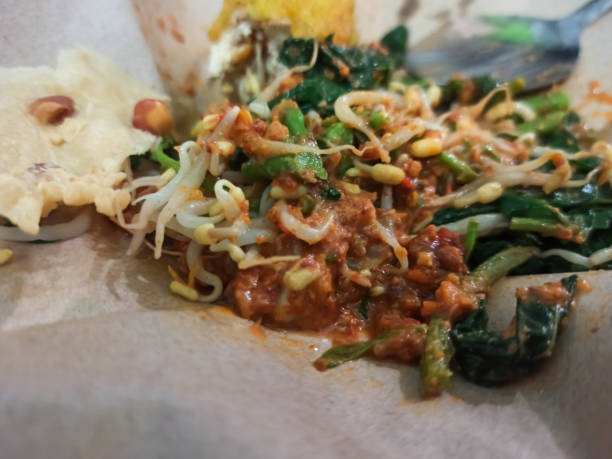 istock On-the-Go Flavor: Pecel and Tofu Wrapped in Oil Paper 1719586820