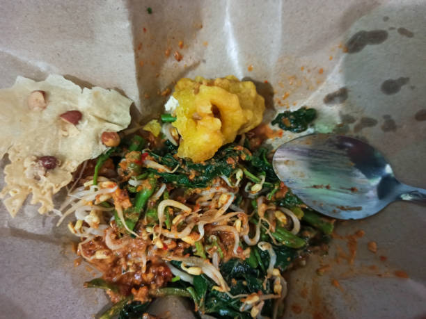 istock Street Food Delight: Pecel and Tofu in Convenient Oil Paper Wraps 1719586831