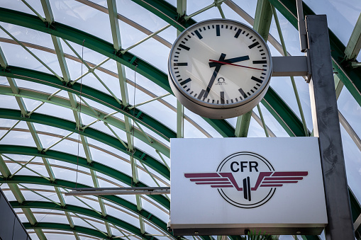 PIcture of the facade of the Bucharest Train station with the logo of CFR Romanian Railways. Cile Ferate Române is the state railway carrier of Romania. The network is significantly interconnected with other European railway networks, providing pan-European passenger and freight services. CFR as an entity has been operating since 1880, even though the first railway on current Romanian territory was opened in 1854. CFR is divided into four autonomous companies.