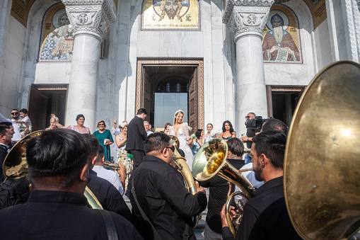 Picture of a Roma band playing their typical instruments (trumpet, trombon, Tuba, etc.) during a wedding in Belgrade, Serbia