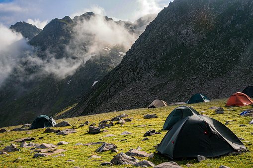 Tents set up in the meadow area between Yedigöller region of Kaçkar Mountains and Verçenik Valley. Kaçkar Mountains National Park